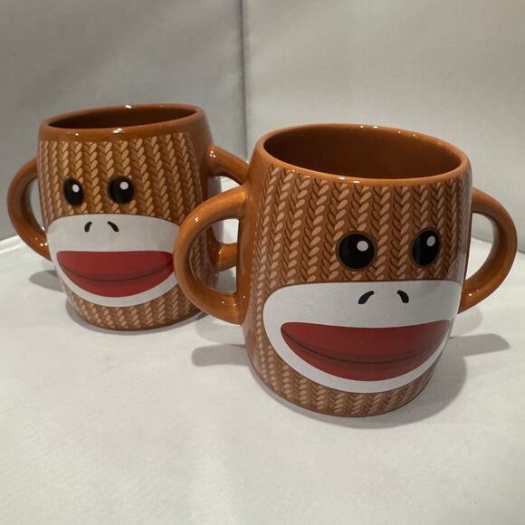Pair of brown Galerie two-handle ceramic sock monkey mugs - Picture 3 of 4